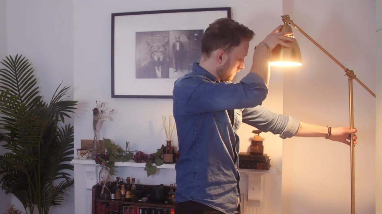 Tom adjusting household lighting, - How to improve your webcam quality