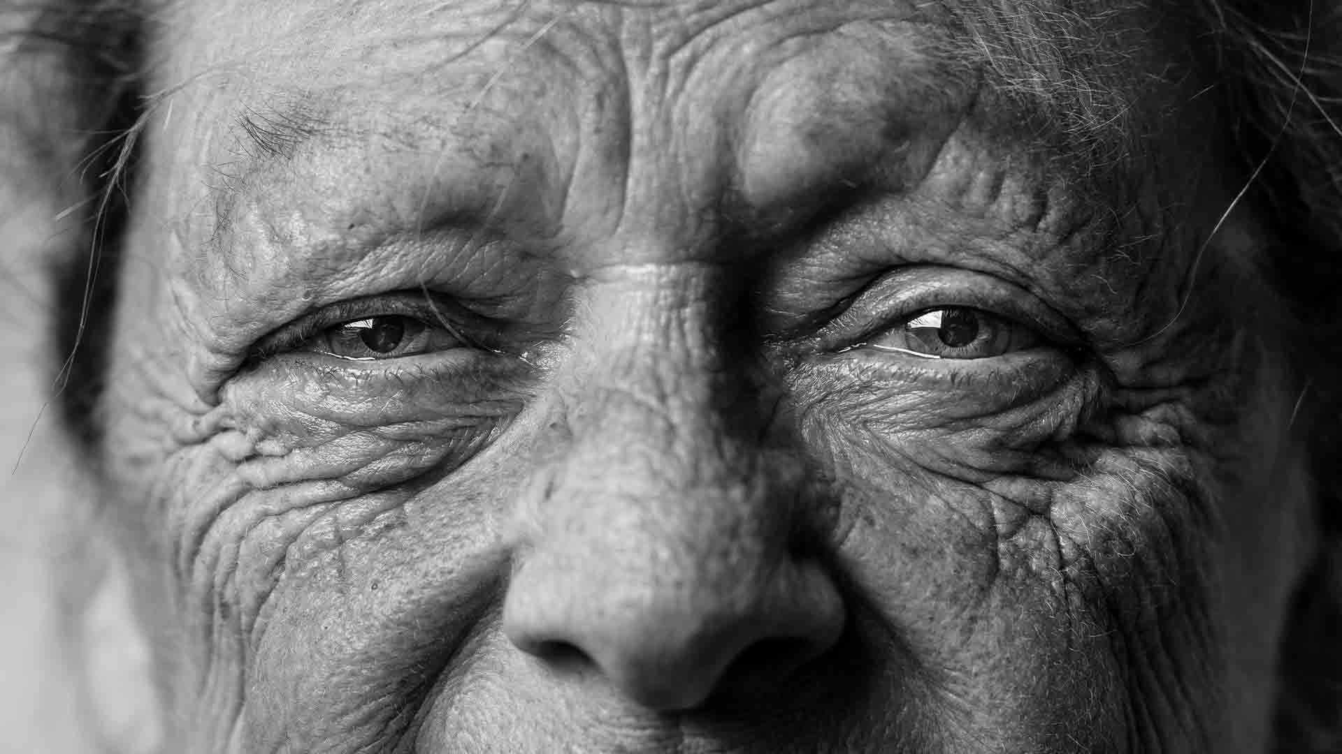 How to use depth of field to draw attention to a subject - old man close up portrait