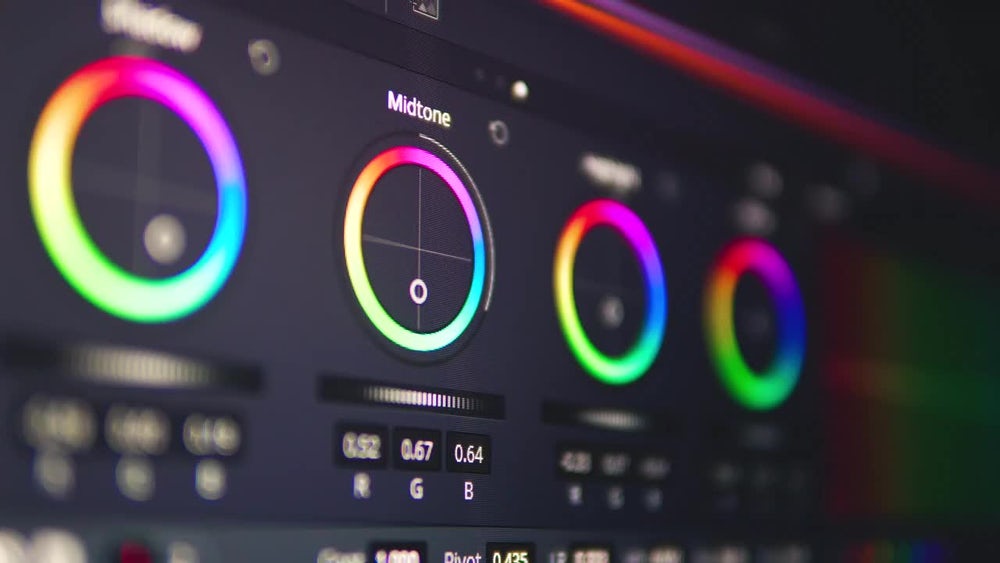 Screenshot of a video editor interface, showing color wheels being used to adjust hue, saturation and brightness.