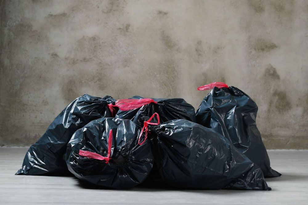 A pile of black household bin bags