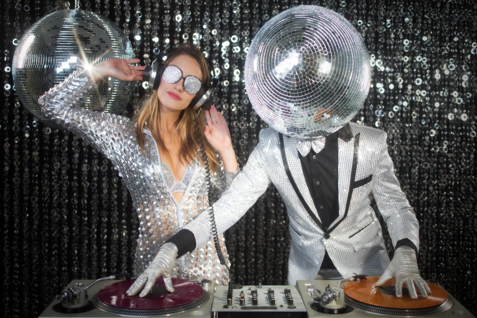 glitter ball DJ and dancer with sequin background