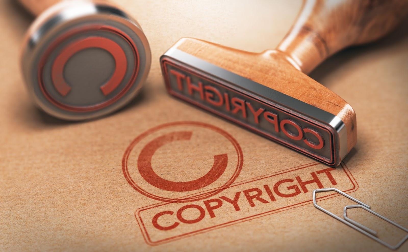 Copyright stamp in red on brown paper
